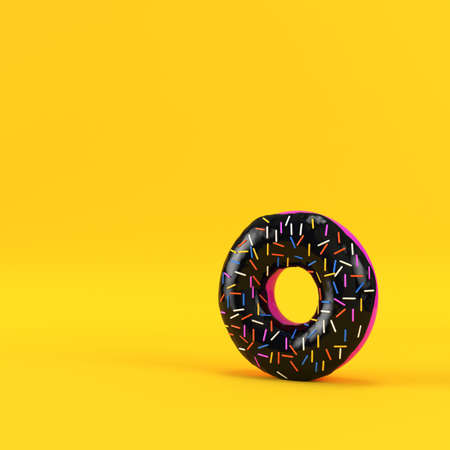Donut with black glaze and sprinkles on yellow background. 3d renderの写真素材