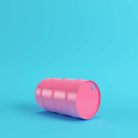 Pink oil barrel on bright blue background in pastel colors. Minimalism concept. 3d renderの写真素材