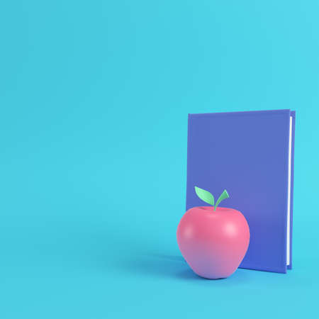 Pink apple and book on bright blue background in pastel colors. Minimalism concept. 3d renderの写真素材