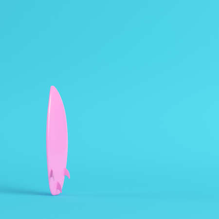 Pink surfboard on bright blue background in pastel colors. Minimalism concept. 3d renderの写真素材