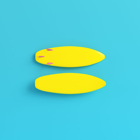 Yellow surfboards on bright blue background in pastel colors. Minimalism concept. 3d render