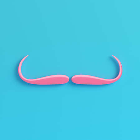 Pink fake moustache on bright blue background in pastel colours.の写真素材