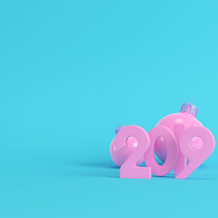 Pink new year 2019 figures with christmas balls on bright blue background in pastel colors. Minimalism concept. 3d renderの写真素材