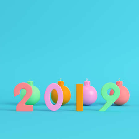Four colorful new year 2019 figures with christmas balls on bright blue background in pastel colors. Minimalism concept. 3d renderの写真素材