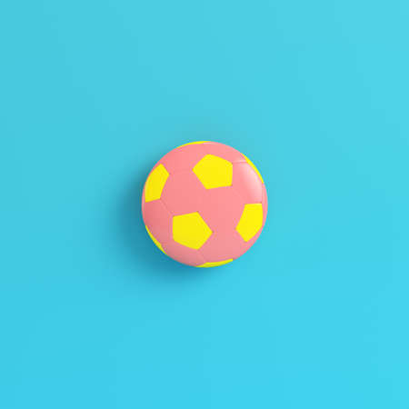 Yellow soccer ball on bright blue background in pastel colors. Minimalism concept. 3d renderの写真素材