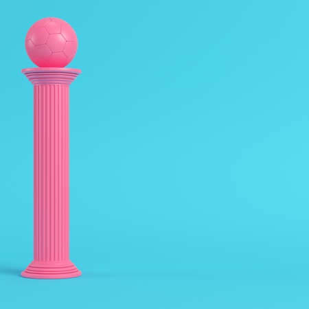Pink column with soccer ball on bright blue background in pastel colors. Minimalism concept. 3d renderの写真素材