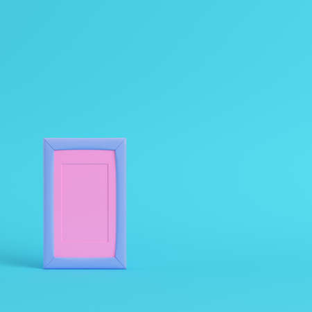 Pink blank frame on bright blue background in pastel colors. Minimalism concept. 3d renderの写真素材
