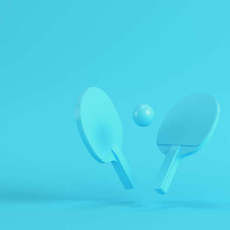 table tennis rackets with ball on bright blue background in pastel colors. Minimalism concept. 3d renderの写真素材