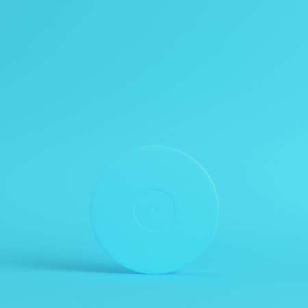 Vinyl record on bright blue background in pastel colors. Minimalism concept. 3d renderの写真素材