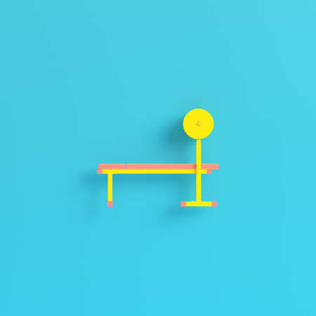Yellow barbell on bench blue background in pastel colors. Minimalism concept. 3d renderの写真素材