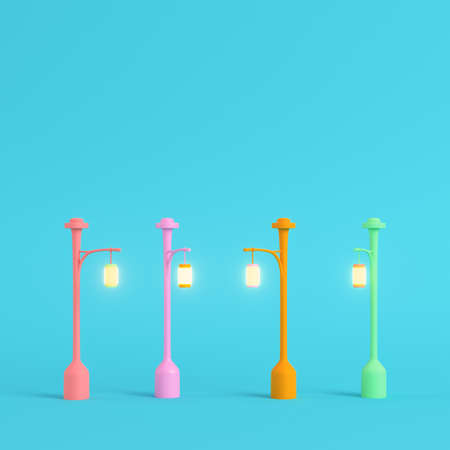 Four colorful street lights on bright blue background in pastel colors. Minimalism concept. 3d renderの写真素材