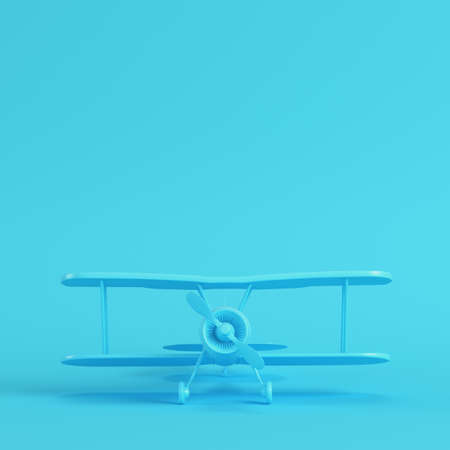 Biplane on bright blue background in pastel colors. Minimalism concept. 3d renderの写真素材