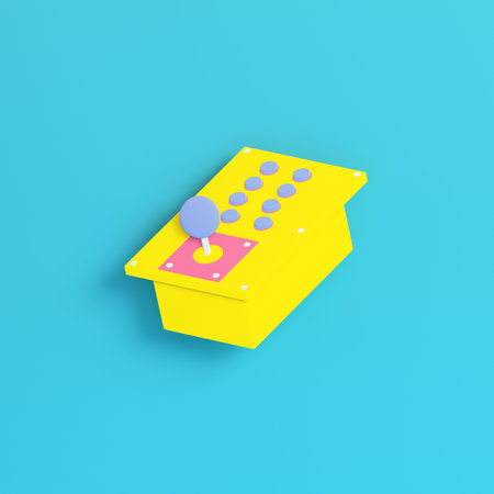 Yellow retro arcade game controller on bright blue background in pastel colors. Minimalism concept. 3d renderの写真素材