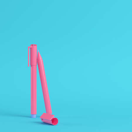 Pink marker pens on bright blue background in pastel colors. Minimalism concept. 3d renderの写真素材