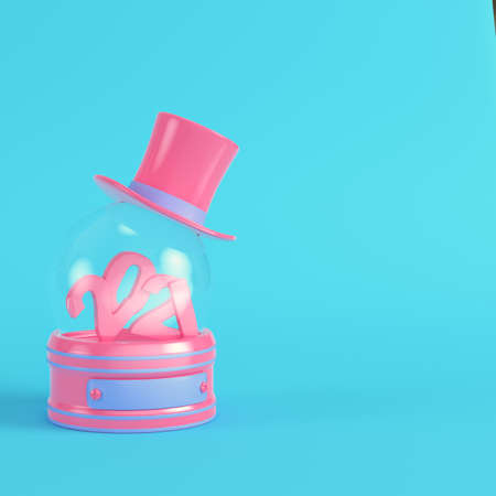 Pink snow globe with 2021 figures and top hat on bright blue background in pastel colors. Minimalism concept. 3d renderの写真素材