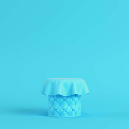 Stitched pedestal covered by fabric on bright blue background in pastel colors. Minimalism concept. 3d renderの写真素材