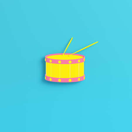 Yellow drum with drum sticks on bright blue background in pastel colors. Minimalism concept. 3d renderの写真素材