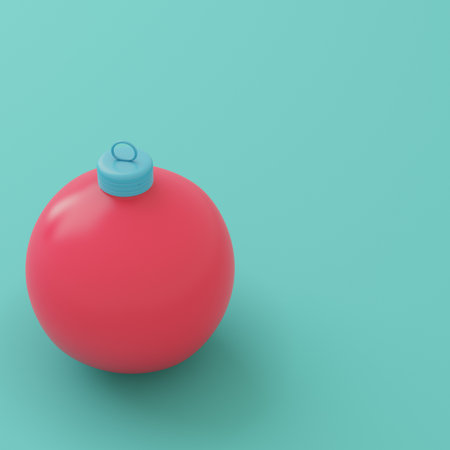 Red christmas bauble on bright turquoise background in pastel colors. Minimalism concept. 3d renderの写真素材