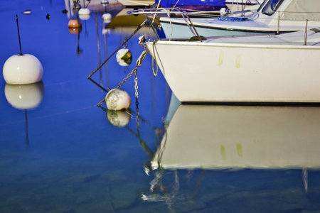 A sailboat on a boat hauler in a Geneva marina.