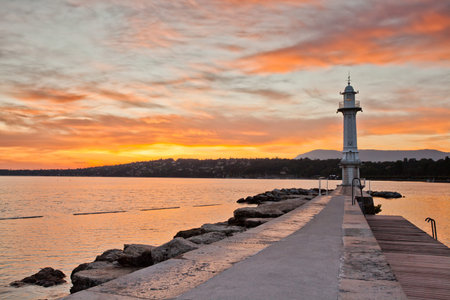 The old lighthouse in Lake Geneva at Geneva, Switzerland at sunrise.の写真素材