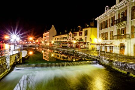 Medieval building at the popular tourist attraction at Quay Perriere, Annecy France at dawn.のeditorial素材