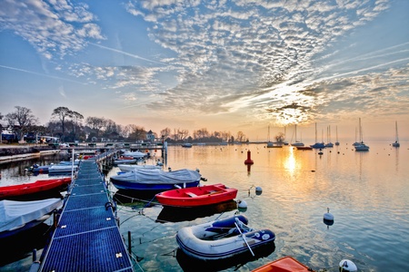 Sunrise at Lake Geneva, Switzerland with sailboats and yachts の写真素材