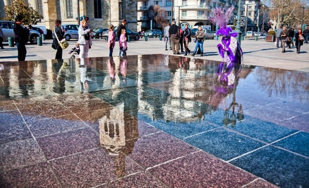 Annecy, France - March 3rd, 2012. Masked participant at the annual Annecy Venetian Festival のeditorial素材