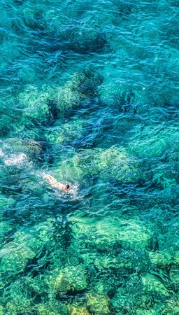 The turquoise color sea at Corniglia, Cinque Terre, Liguria, Italyの写真素材