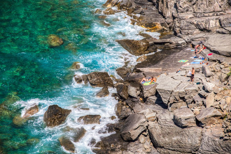 Corniglia, Cinque Terre, Italy. August 6, 2012. View of Cinque Terre coastal beach with people in...