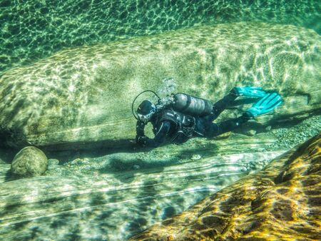 Lavertezzo, Verzasca Valley, Ticino, Switzerland. September 15th 2012. Scuba diving in Verzasca riverのeditorial素材