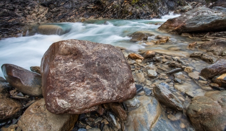 The alpine mountain stream of Dora di Ferret at Val Veny, Italyの写真素材