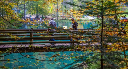 October 6th, 2012, Tourists enjoying the view of the crystal clear lake at Blausee, Switzerland.のeditorial素材