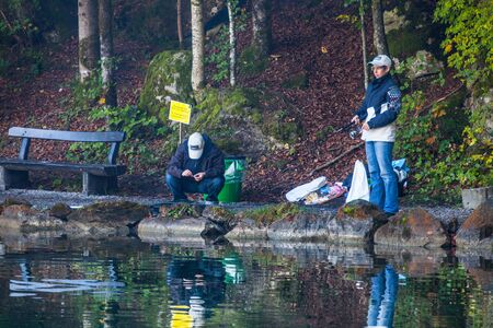 Blausee, Switzerland, October 6th, 2012. Anglers enjoying the autumn trouts fishing at the Blausee lake. のeditorial素材
