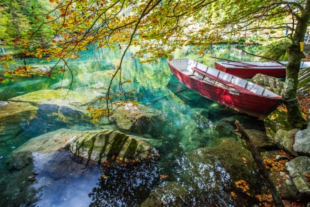 Red boats by the lakeの写真素材
