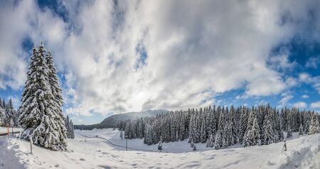 Panorama view of Jura mountain range winter landscape at La Givrine, St Cergue, Switzerlandの写真素材