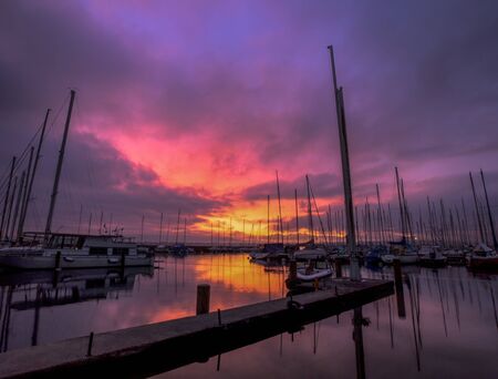 Sailboats at dawn and sunrise in Lake Geneva, Switzerlandの写真素材