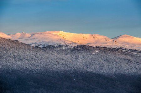Sunrise morning lights reflected on the mountain snow