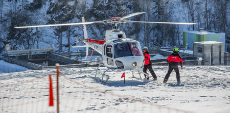 Chateau de Oex, Switzerland, 26th January 2013. A helicopter landing at a snow field at the 35th International Hot Air Balloon festival. It is being held from 26th January to 3rd February 2013.のeditorial素材