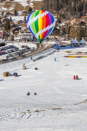 Chateau de Oex, Switzerland, 26th January 2013. Hot air balloons at the 35th International Hot Air Balloon festival. It is being held from 26th January to 3rd February 2013.のeditorial素材
