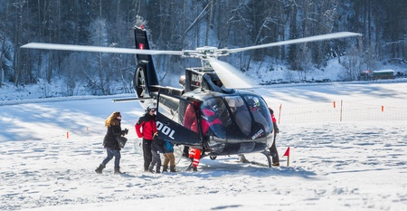 Chateau de Oex, Switzerland, 26th January 2013. A helicopter landing at a snow field at the 35th International Hot Air Balloon festival. It is being held from 26th January to 3rd February 2013.のeditorial素材
