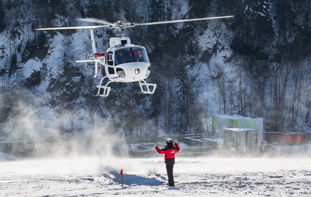 Chateau de Oex, Switzerland, 26th January 2013. A helicopter landing at a snow field at the 35th International Hot Air Balloon festival. It is being held from 26th January to 3rd February 2013.のeditorial素材