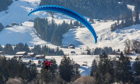 Chateau de Oex, Switzerland, 26th January 2013. Paraglider at the 35th International Hot Air Balloon festival. It is being held from 26th January to 3rd February 2013.のeditorial素材