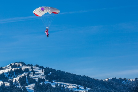 Chateau de Oex, Switzerland, 26th January 2013. Parachutists at the 35th International Hot Air Balloon festival. It is being held from 26th January to 3rd February 2013.のeditorial素材