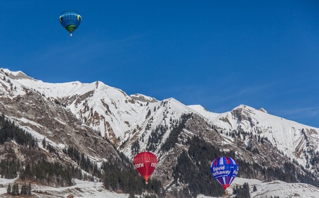 Chateau de Oex, Switzerland, 26th January 2013. Hot air balloons at the 35th International Hot Air Balloon festival. It is being held from 26th January to 3rd February 2013.のeditorial素材