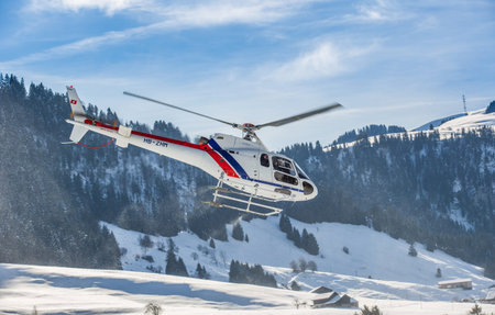 Chateau de Oex, Switzerland, 26th January 2013. A helicopter flying at a snow field at the 35th...