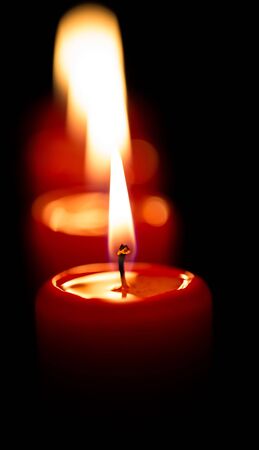 Red candles with black backgroundの写真素材