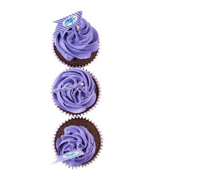 Purple cupcakes with flags on a white backgroundの写真素材