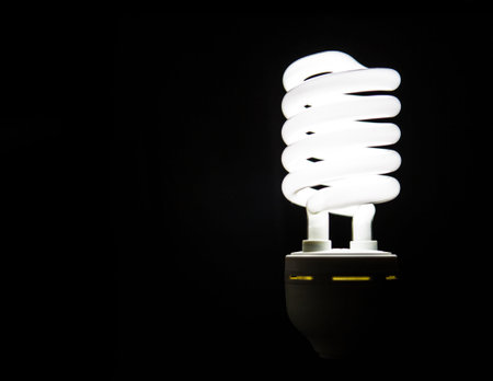 Light bulb over black background