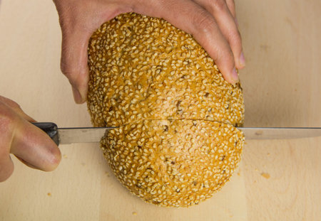 Cutting sesame seed bread