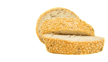 Pieces of sesame seed bread with white background